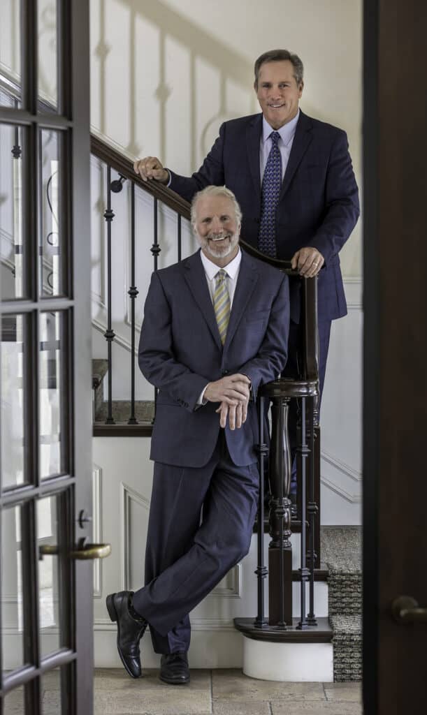 Richard & William Donahoo on the stairs in their legal office.